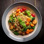 A vibrant vegetarian platter featuring roasted vegetables, quinoa, and fresh herbs.