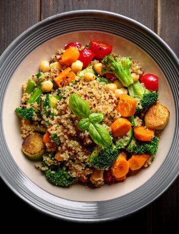 A vibrant vegetarian platter featuring roasted vegetables, quinoa, and fresh herbs.